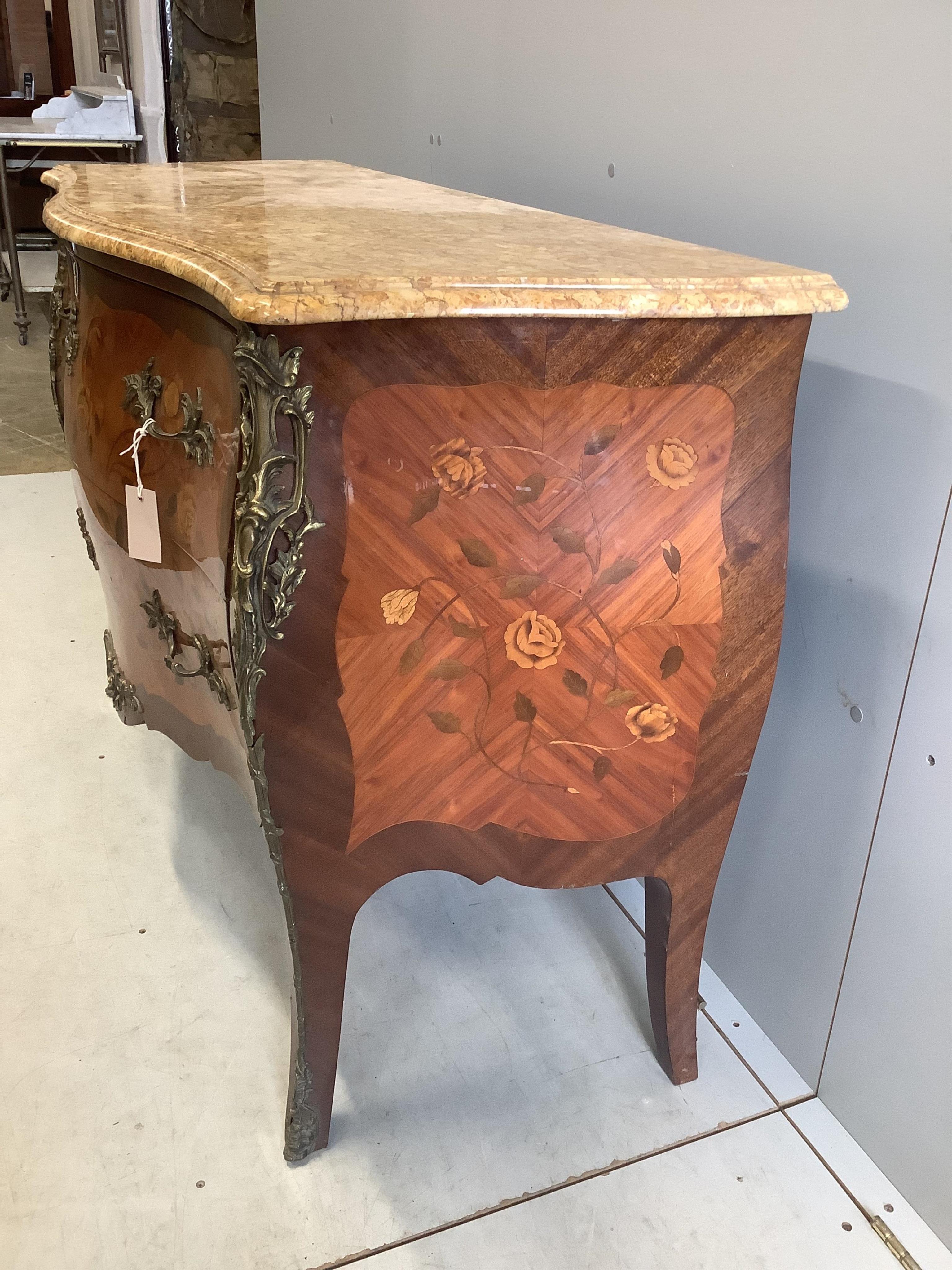 A Louis XVI style marquetry inlaid gilt metal mounted marble topped bombe commode, width 122cm, depth 51cm, height 86cm. Condition - fair, marble top damaged, now in two pieces